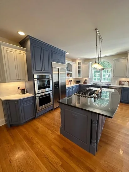 Kitchen Cabinets Refinish Project with completed blue and white cabinet contrast